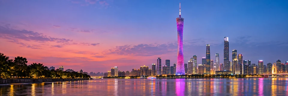 Illustrative Canton Tower and Guangzhou skyline over the Pearl River at blue hour